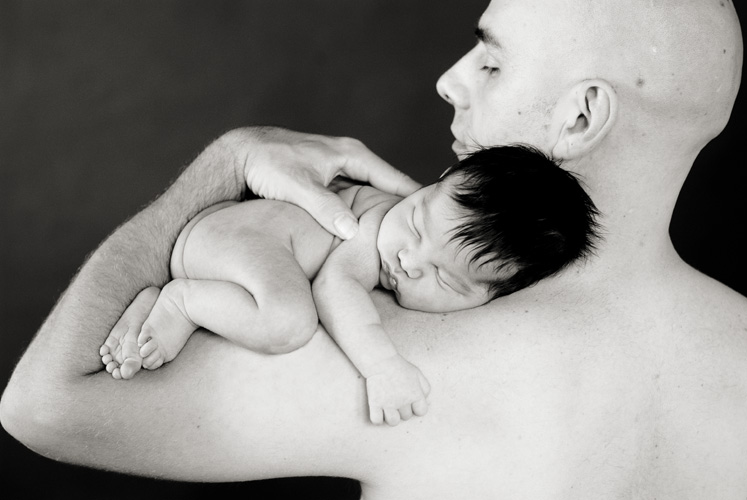 Black and White Studio Portrait of Father with Newborn